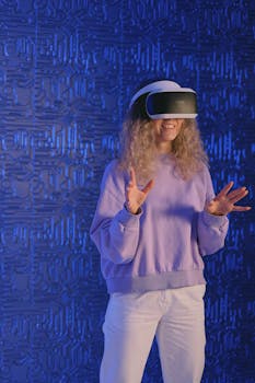 A woman wearing a VR headset engages with virtual reality in a modern studio setting.